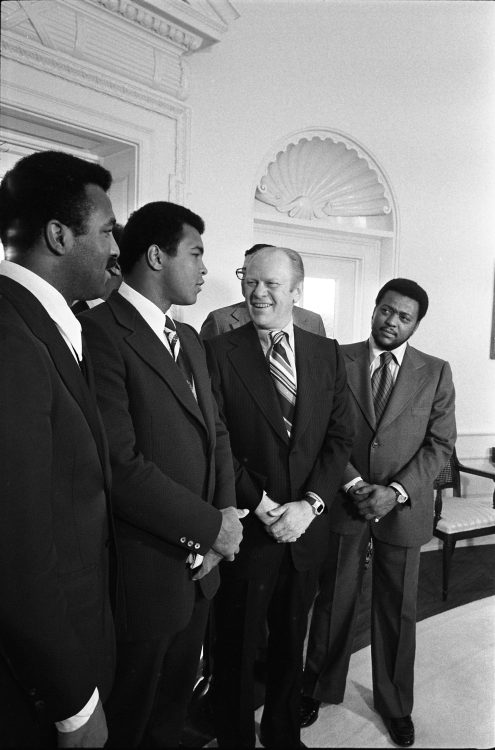 1974, December 10 – The Oval Office – The White House – Washington, DC – Gerald R. Ford, Muhammad Ali, Herbert Muhammad, Stanley Scott, Others – greeting, handshaking, standing, talking – Professional Boxer and Heavyweight Champion; Manager