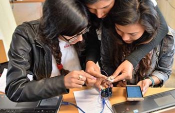 students with electronics